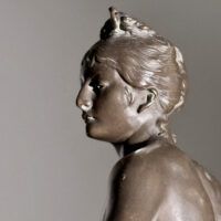 Alt text: Bronze sculpture of the Goddess Diana, detail
