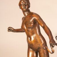 Alt text: Bronze sculpture of the Goddess Diana, detail
