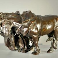 Alt text: Bronze sculpture of two horses