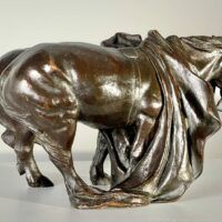 Alt text: Bronze sculpture of two horses