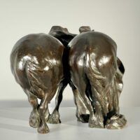 Alt text: Bronze sculpture of two horses