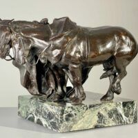 Alt text: Bronze sculpture of two horses