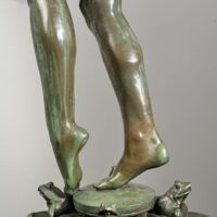 Alt text: Bronze sculpture, detail of two feet among frogs