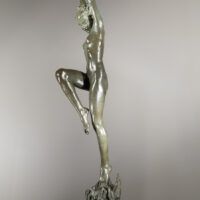 Alt text: Bronze sculpture of a standing woman