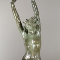 Alt text: Bronze sculpture of a standing woman