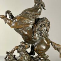 Alt text: Bronze sculpture of a lion attacking a horse