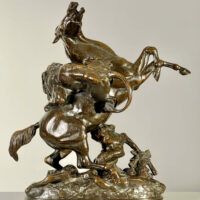 Alt text: Bronze sculpture of a lion attacking a horse