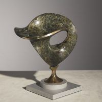 Alt text: Abstract bronze sculpture of two distorted and conjoined circles