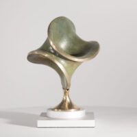 Alt text: Round bronze sculpture