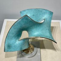 Alt text: Abstract bronze of conjoined shapes