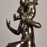 Alt text: Bronze sculpture of Psyche seated with Cupid on her shoulders