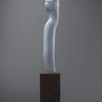 Alt text: Abstract blue alabaster sculpture resembling the female form