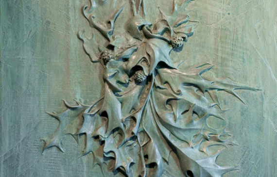 Alt text: Bronze relief of fallen oak leaves