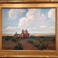 Alt text: Oil painting of men on horseback riding through the desert with a stagecoach beyond them, framed