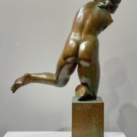 Alt text: Bronze sculpture of a fragmented nude woman