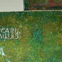 Alt text: Bronze sculpture, signature detail