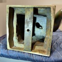 Alt text: Bronze sculpture underside