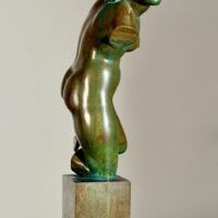 Alt text: Bronze sculpture of a fragmented nude woman