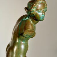 Alt text: Bronze sculpture of a fragmented nude woman