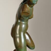 Alt text: Bronze sculpture of a fragmented nude woman