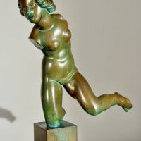 Alt text: Bronze sculpture of a fragmented nude woman