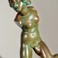 Alt text: Bronze sculpture of a fragmented nude woman
