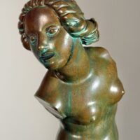 Alt text: Bronze sculpture of a fragmented nude woman