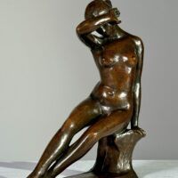Alt text: Bronze sculpture of a nude figure seated with a hand over her eyes