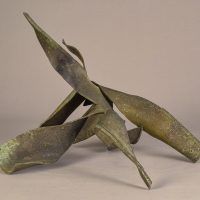 Alt text: Interlocked, torn steel sculpture with abstracted form, view 2