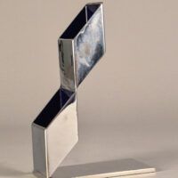 Alt text: Geometric metal sculpture