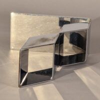 Alt text: Geometric metal sculpture