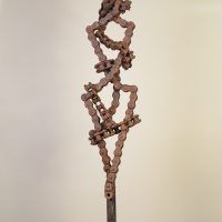 Alt text: Welded chain link sculpture with biomorphic figure, frontal view