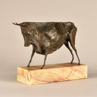 Alt text: Bronze modernist sculpture of a bull atop a marble base