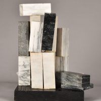 Alt text: Assemblage sculpture composed of different rectangular marble blocks