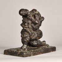 Alt text: Abstract bronze sculpture of two figures embracing