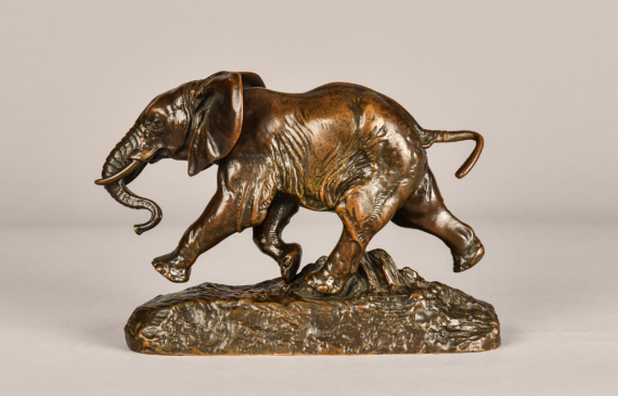 Alt text: Bronze sculpture of a running elephant