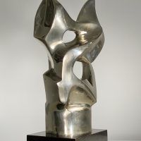 Alt text: Polished bronze sculpture of an abstract cat head, angle view