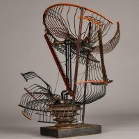 Alt text: Abstract metal sculpture made of a deconstructed oscillating fan