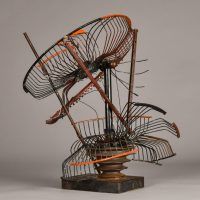 Alt text: Abstract metal sculpture made of a deconstructed oscillating fan