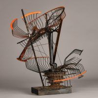 Alt text: Abstract metal sculpture made of a deconstructed oscillating fan