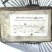 Alt text: Underside of sculpture with gallery label from Sid Deutsch Gallery