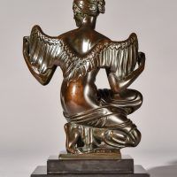 Alt text: Bronze sculpture of Philomela from Greek mythology, kneeling with wings growing from her back