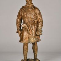 Alt text: Bronze sculpture of a standing soldier