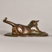 Alt text: Bronze sculpture of a cat stretching
