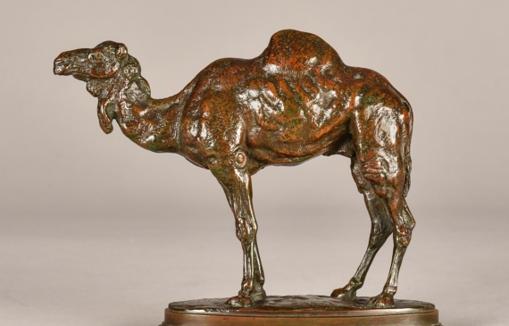 Alt text: Bronze sculpture of a standing camel