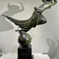 Alt text: Bronze sculpture of a floating woman