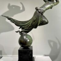 Alt text: Bronze sculpture of an allegorical figure