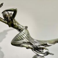 Alt text: Bronze sculpture of an allegorical figure