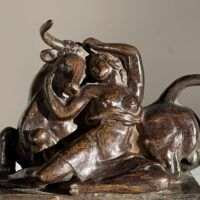 Alt text: Bronze sculpture of a woman with a bull