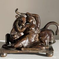 Alt text: Bronze sculpture of a woman with a bull